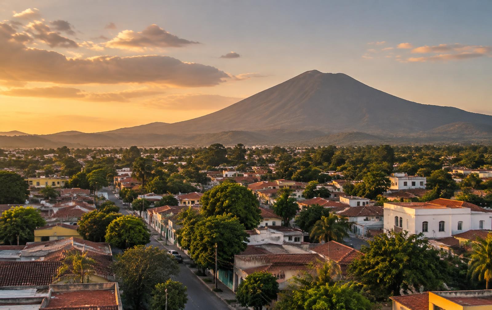 San Miguel at sunset with the Chaparrastique volcano behind the city